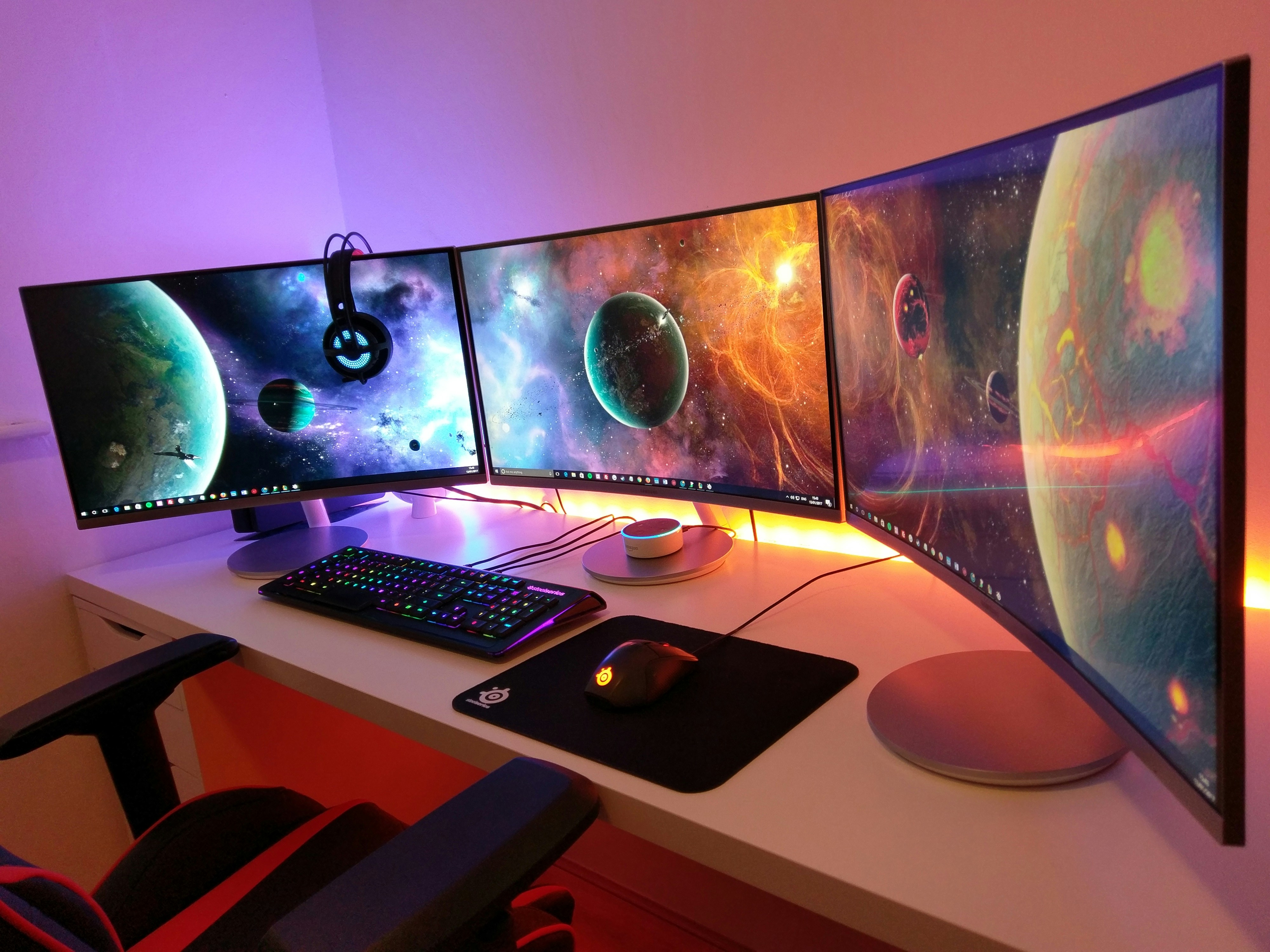 A computer with three monitors.